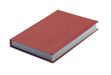 Photo of One closed red hardcover book isolated on white