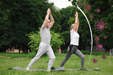 Senior couple practicing yoga outdoors. Healthy lifestyle - base of strong immunity