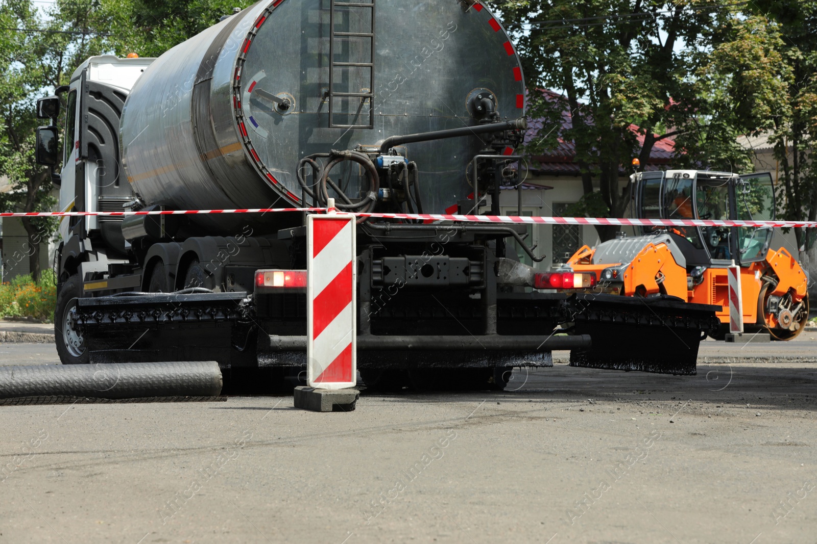 Photo of Road repair machinery working on city street