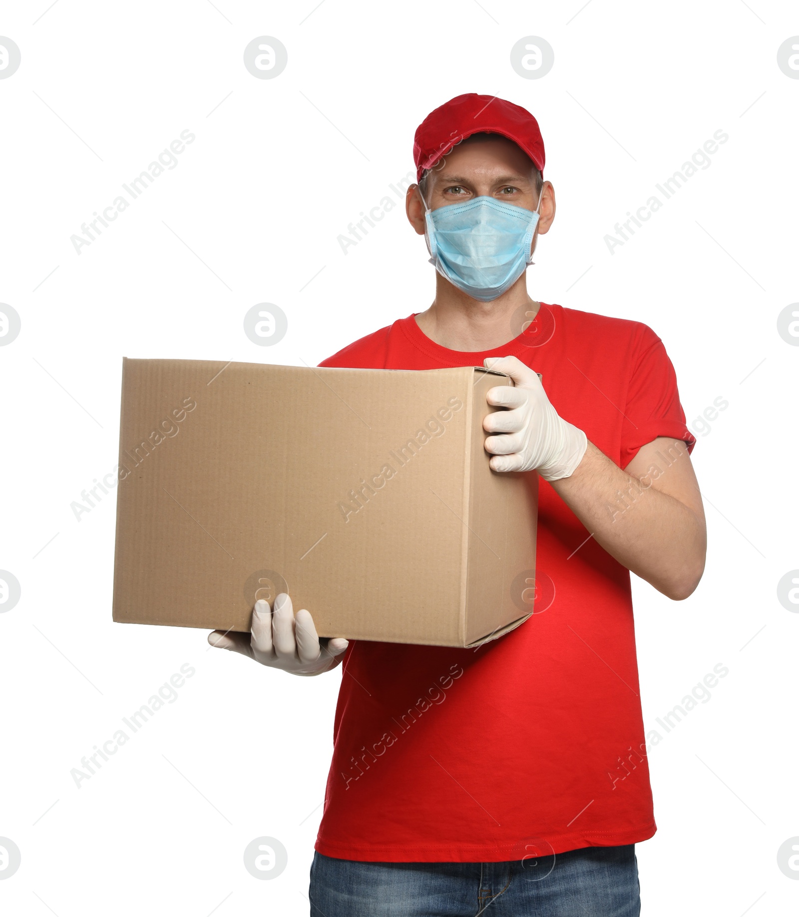 Photo of Courier in protective mask and gloves holding cardboard box on white background. Delivery service during coronavirus quarantine