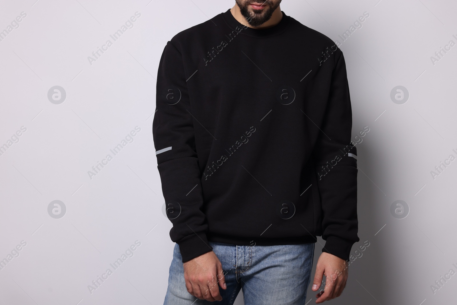 Photo of Man in stylish sweater on white background, closeup