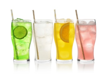 Photo of Delicious refreshing drinks in glasses on white background