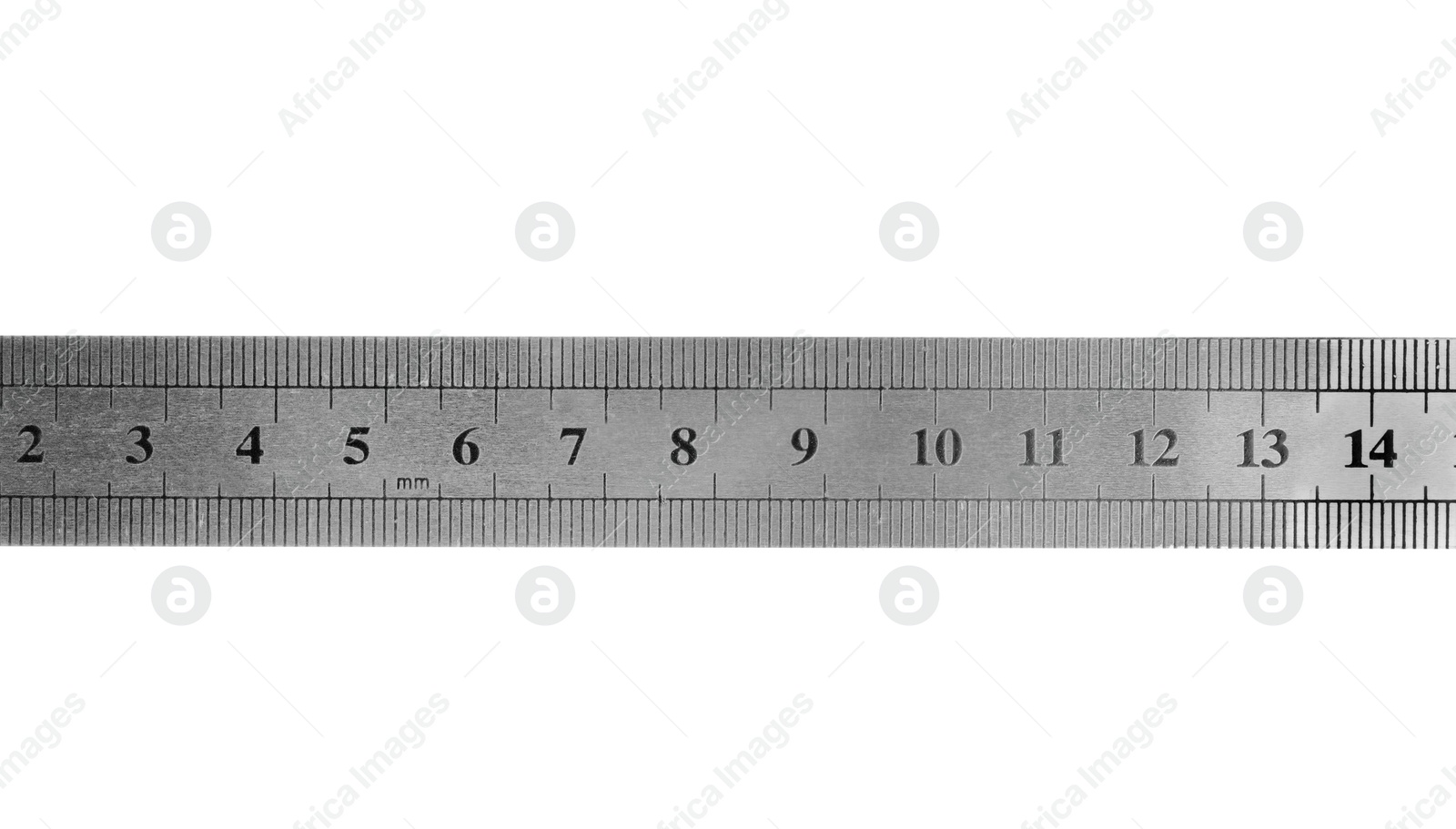 Photo of Metal ruler with measuring length markings in centimeters isolated on white, top view