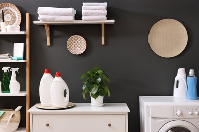 Laundry room interior with washing machine and furniture