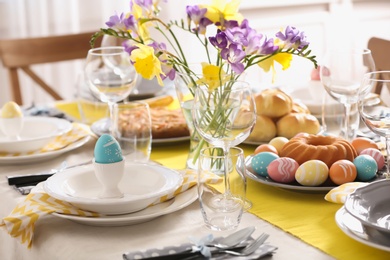 Festive Easter table setting with traditional meal at home