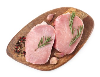 Photo of Wooden board with pieces of raw pork meat and spices isolated on white, top view