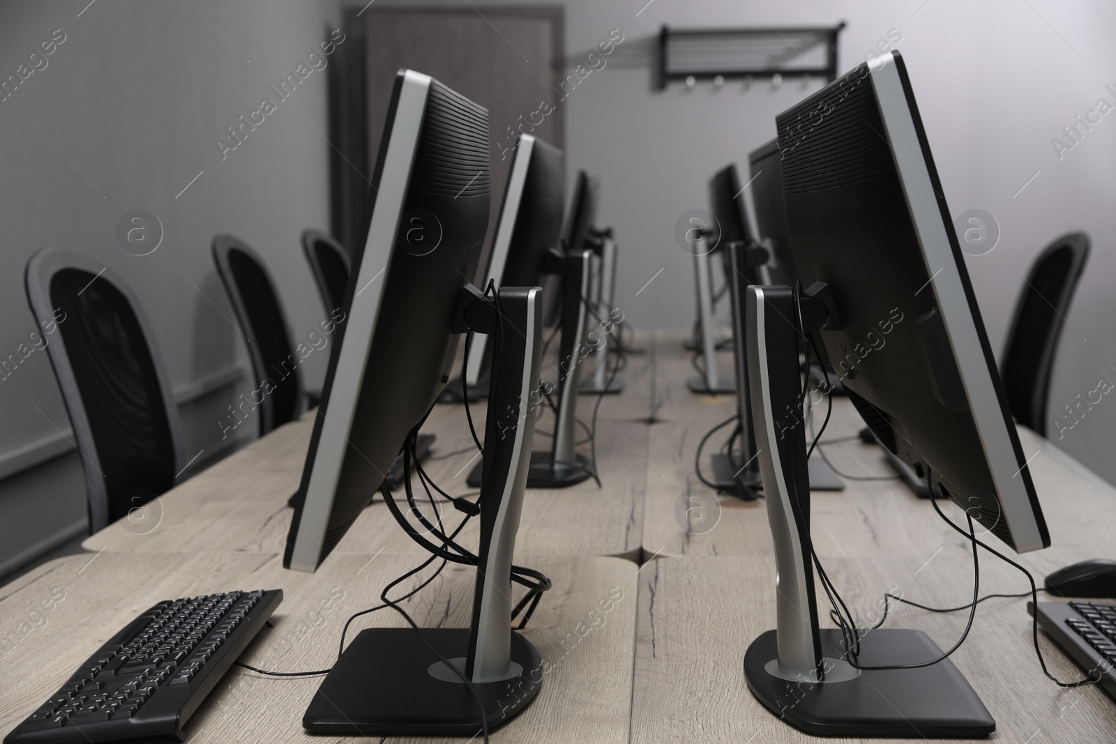 Photo of Many modern computers in open space office