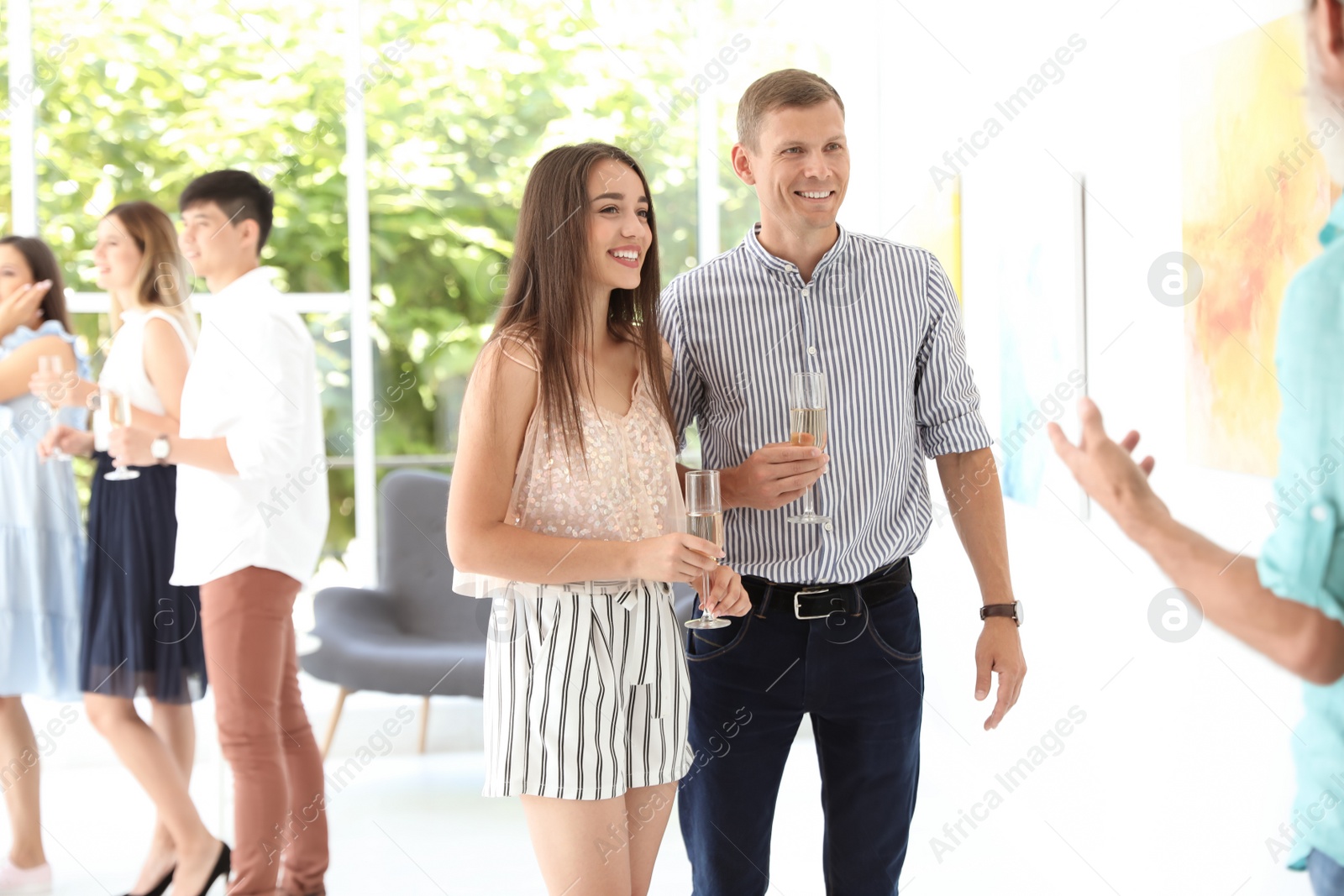 Photo of Young couple at exhibition in art gallery