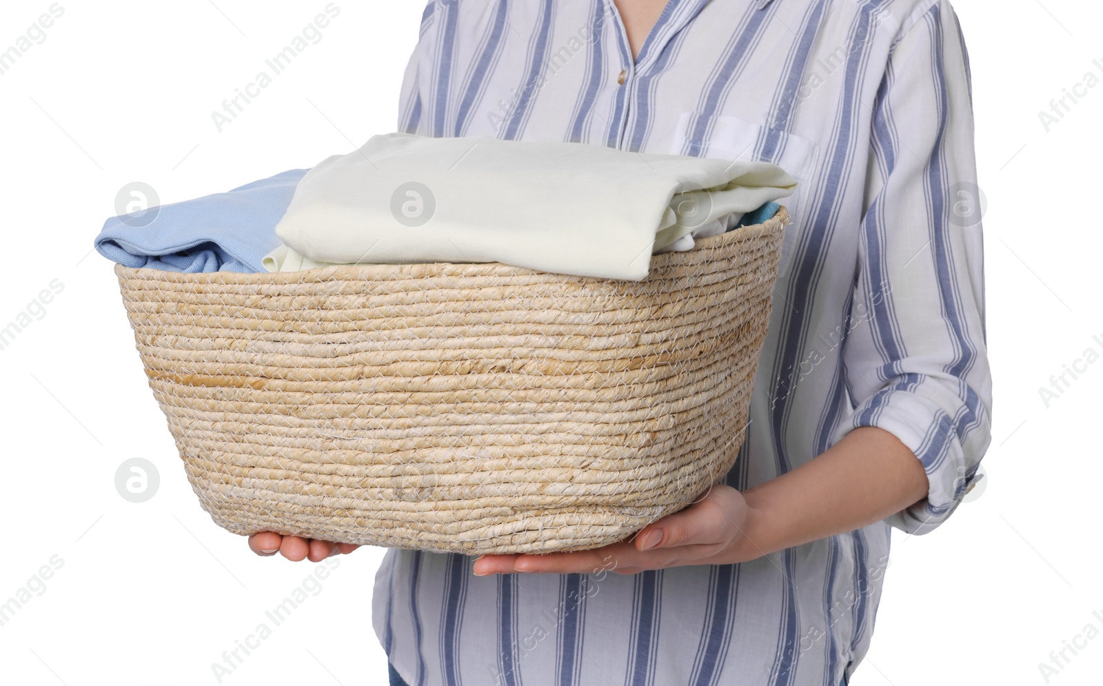 Photo of Woman with basket full of clean laundry on white background, closeup