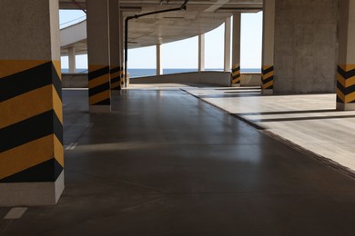 Empty open car parking garage on sunny day