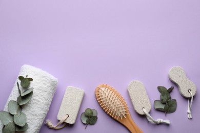 Photo of Flat lay composition with pumice stones on violet background. Space for text
