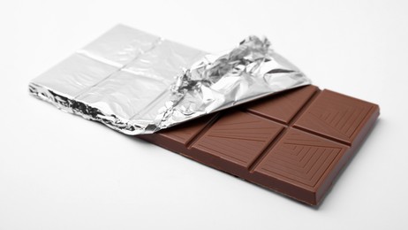 Photo of One tasty chocolate bar on white background