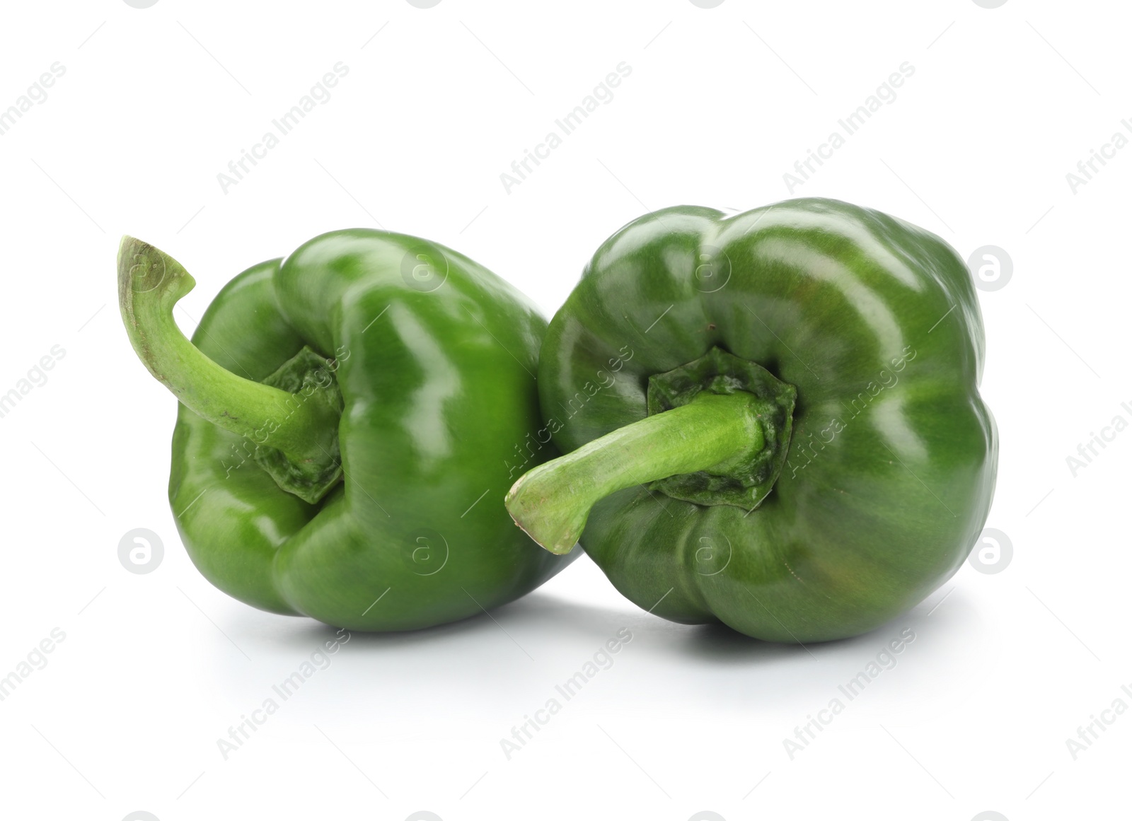 Photo of Ripe green bell peppers on white background