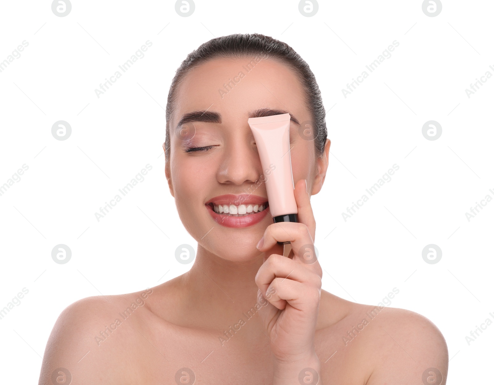 Photo of Woman holding tube of foundation on white background