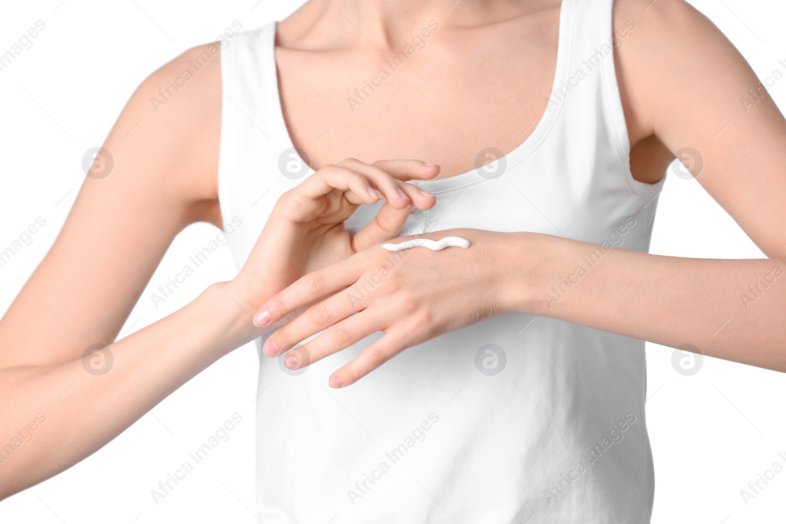 Photo of Young woman applying hand cream on white background, closeup