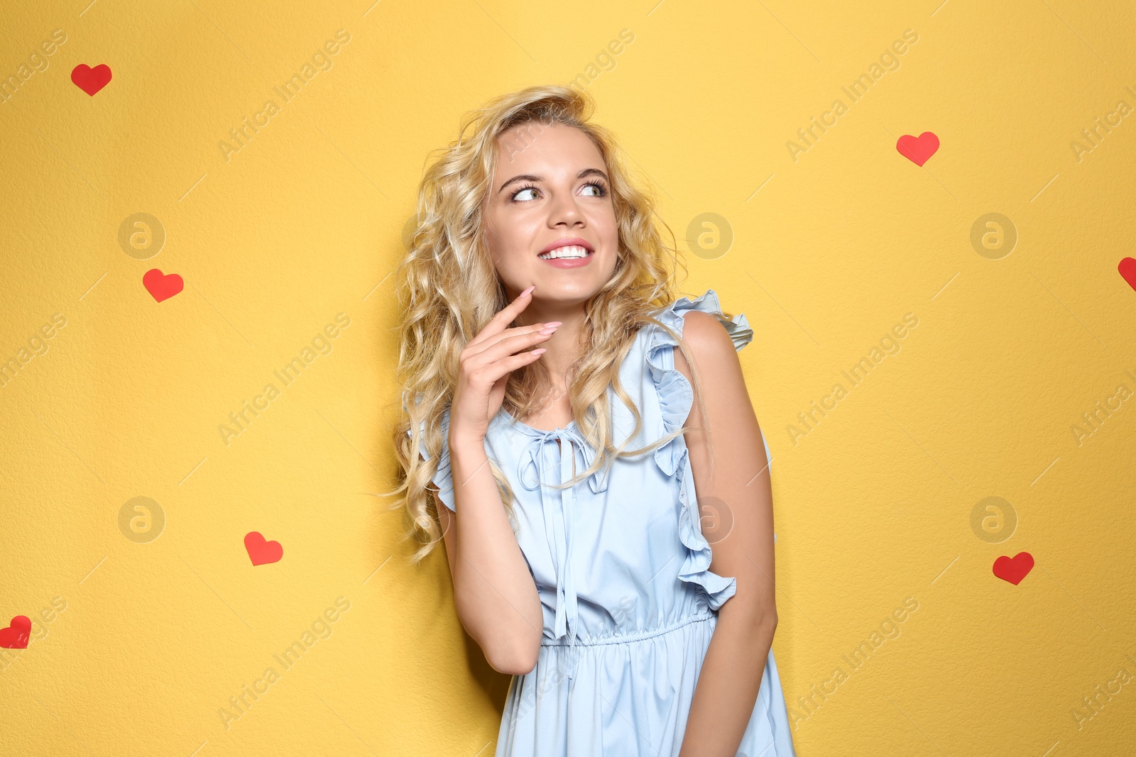 Photo of Stylish young woman posing on color background