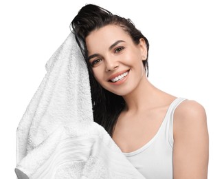 Photo of Happy young woman drying hair with towel after washing on white background