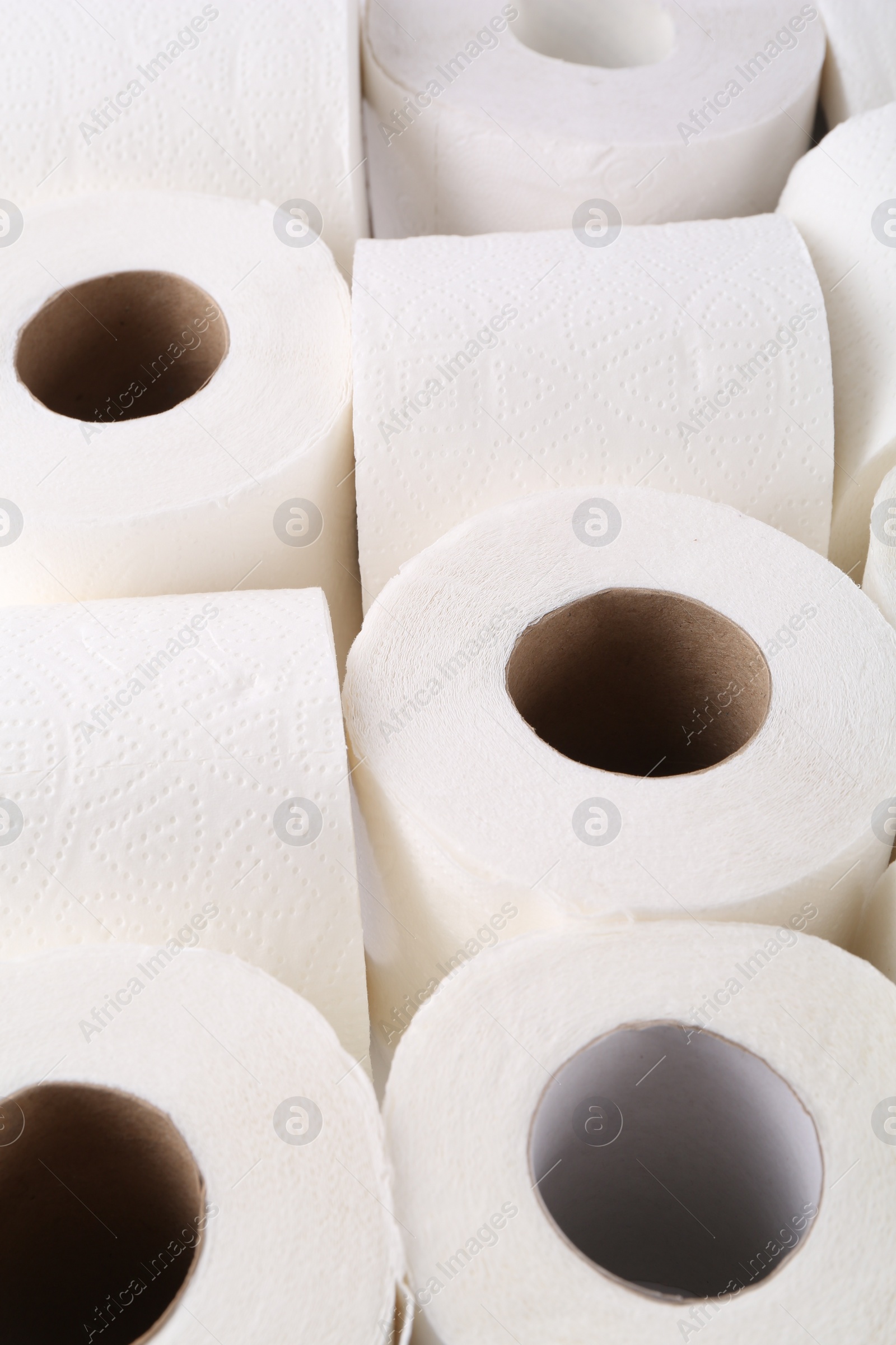 Photo of Many soft toilet paper rolls as background, closeup