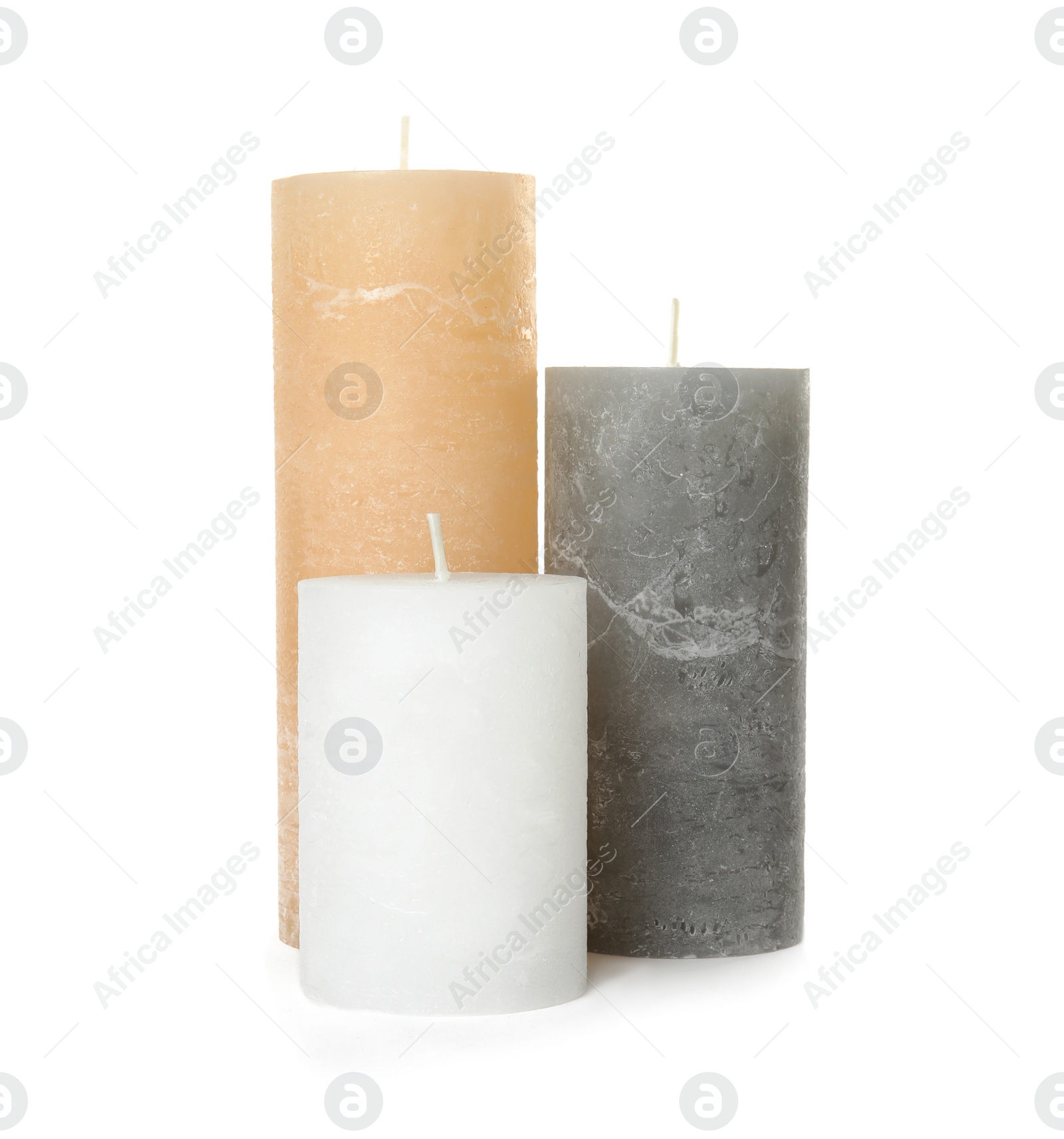 Photo of Three color wax candles on white background