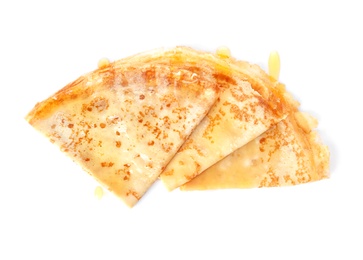 Photo of Tasty thin folded pancakes with honey on white background, top view