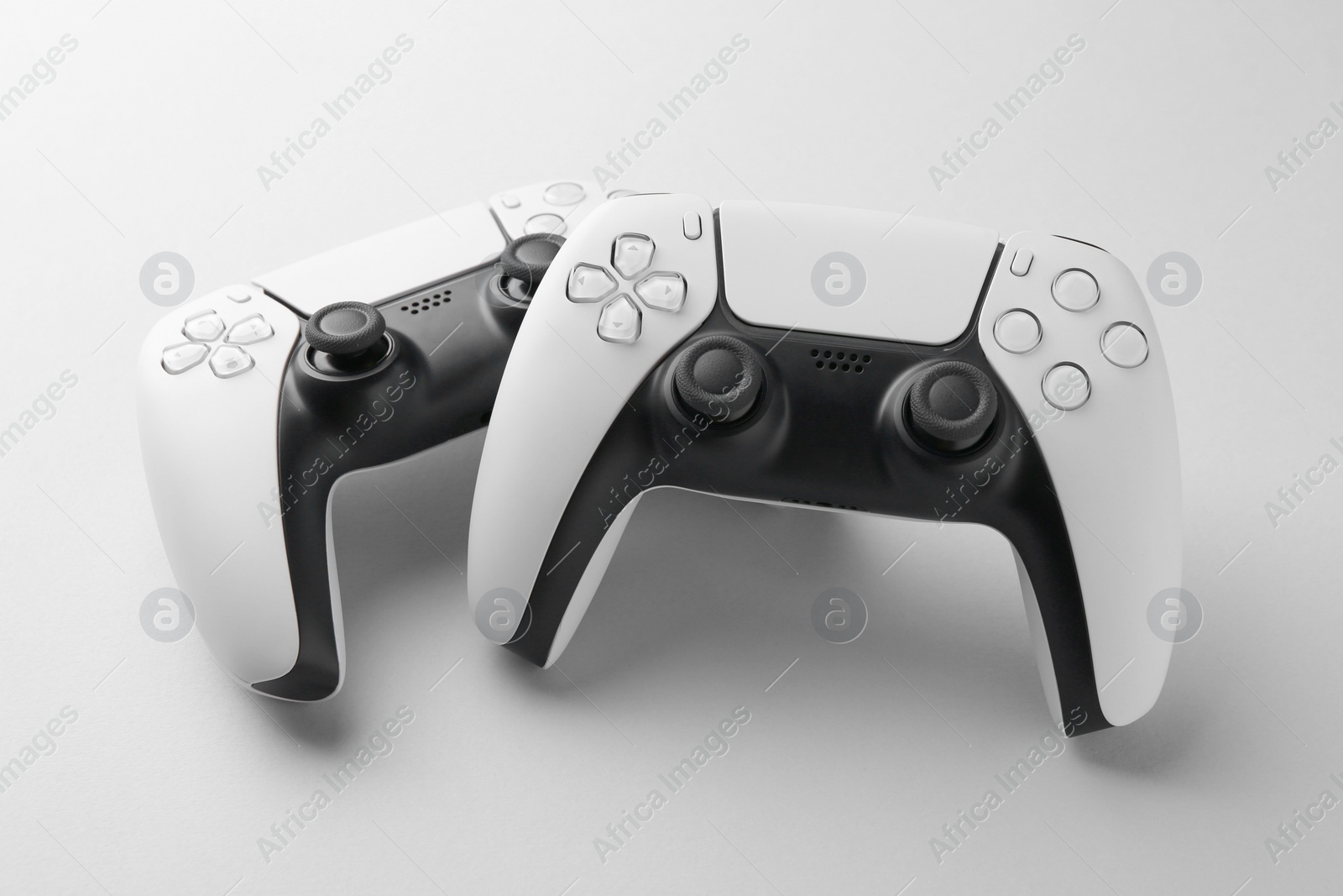 Photo of Wireless game controllers on light grey background