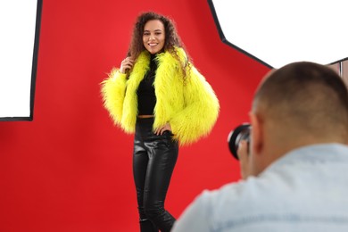 Photo of Beautiful African American model posing for professional photographer in studio