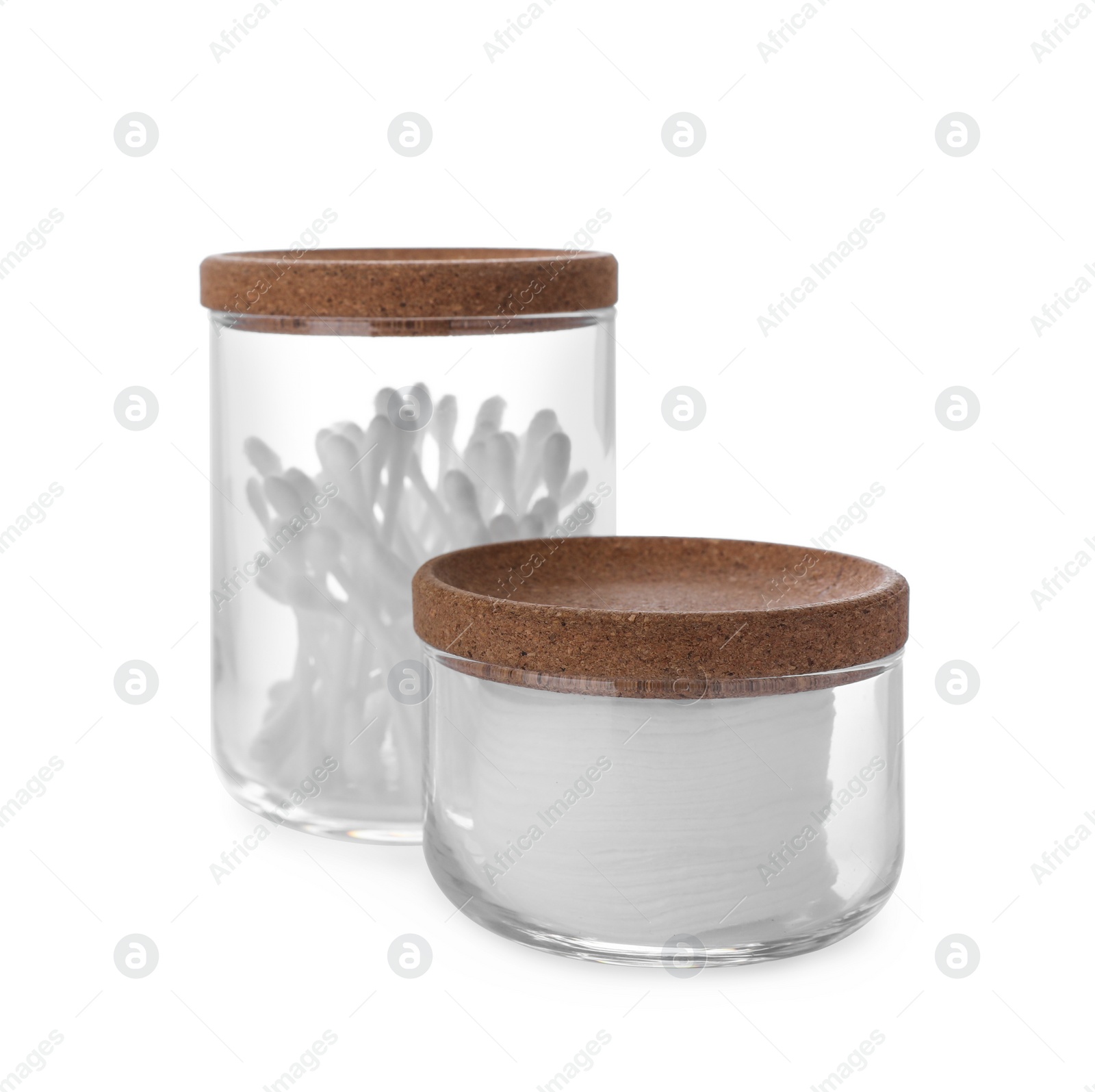 Photo of Cotton pads and swabs in glass jars on white background