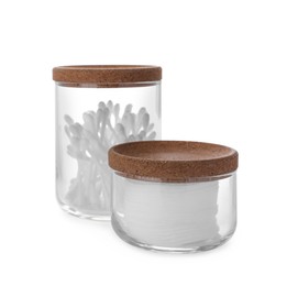 Photo of Cotton pads and swabs in glass jars on white background