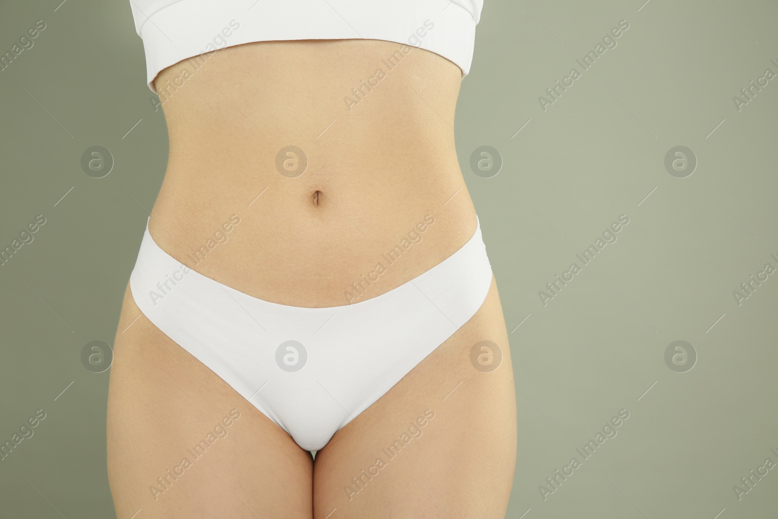 Photo of Gynecology. Woman in underwear on grey background, closeup. Space for text