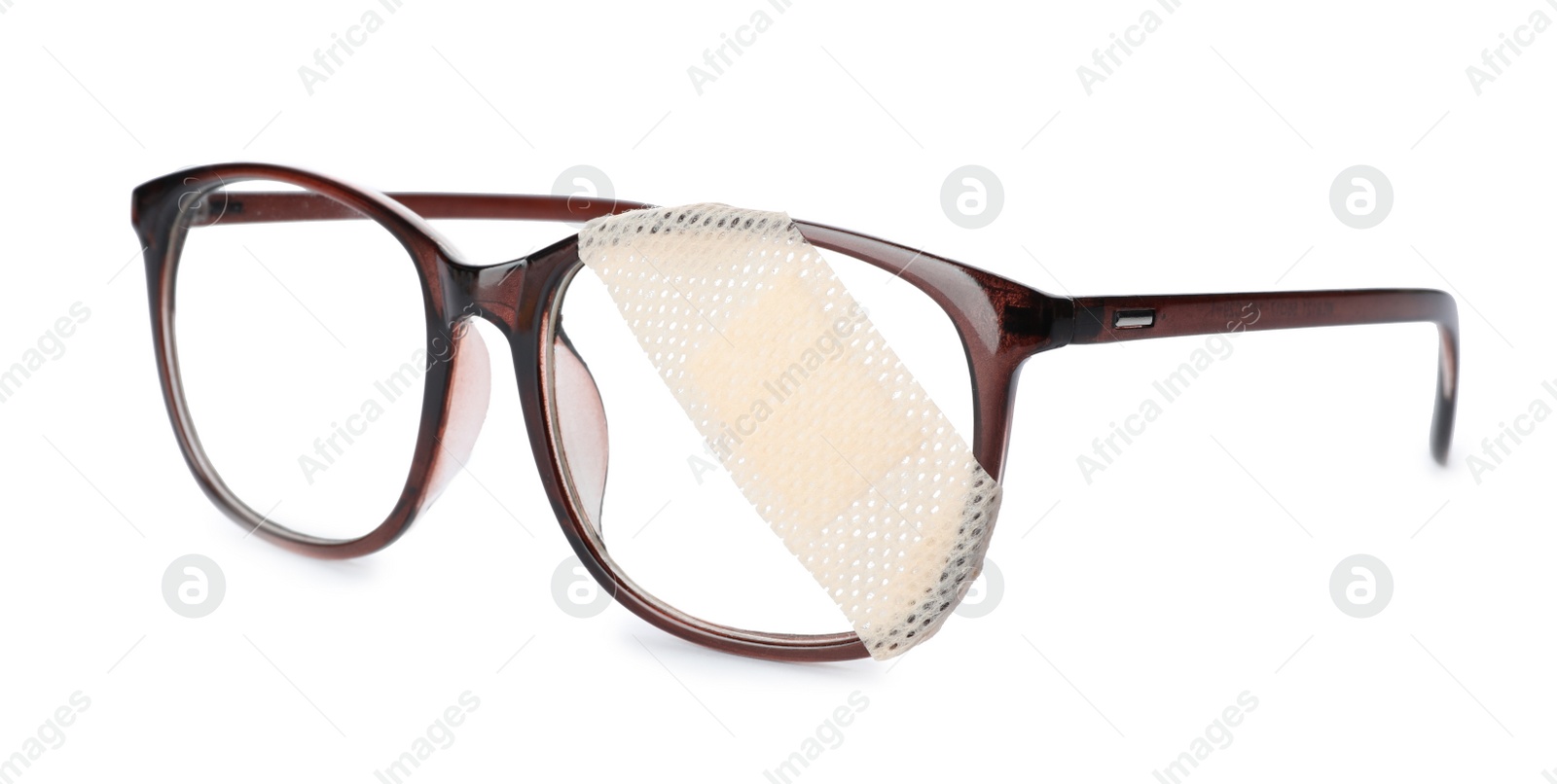 Photo of Glasses with sticking plaster isolated on white