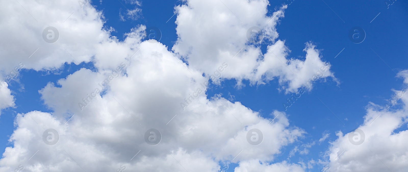 Image of Picturesque view of beautiful blue sky with fluffy clouds on sunny day, banner design