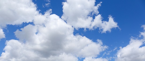 Image of Picturesque view of beautiful blue sky with fluffy clouds on sunny day, banner design