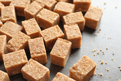 Cubes of brown sugar on table