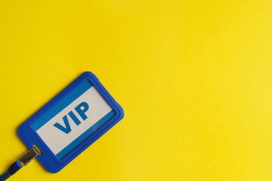 Vip badge on yellow background, top view. Space for text