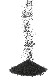 Image of Black sesame seeds falling into pile on white background