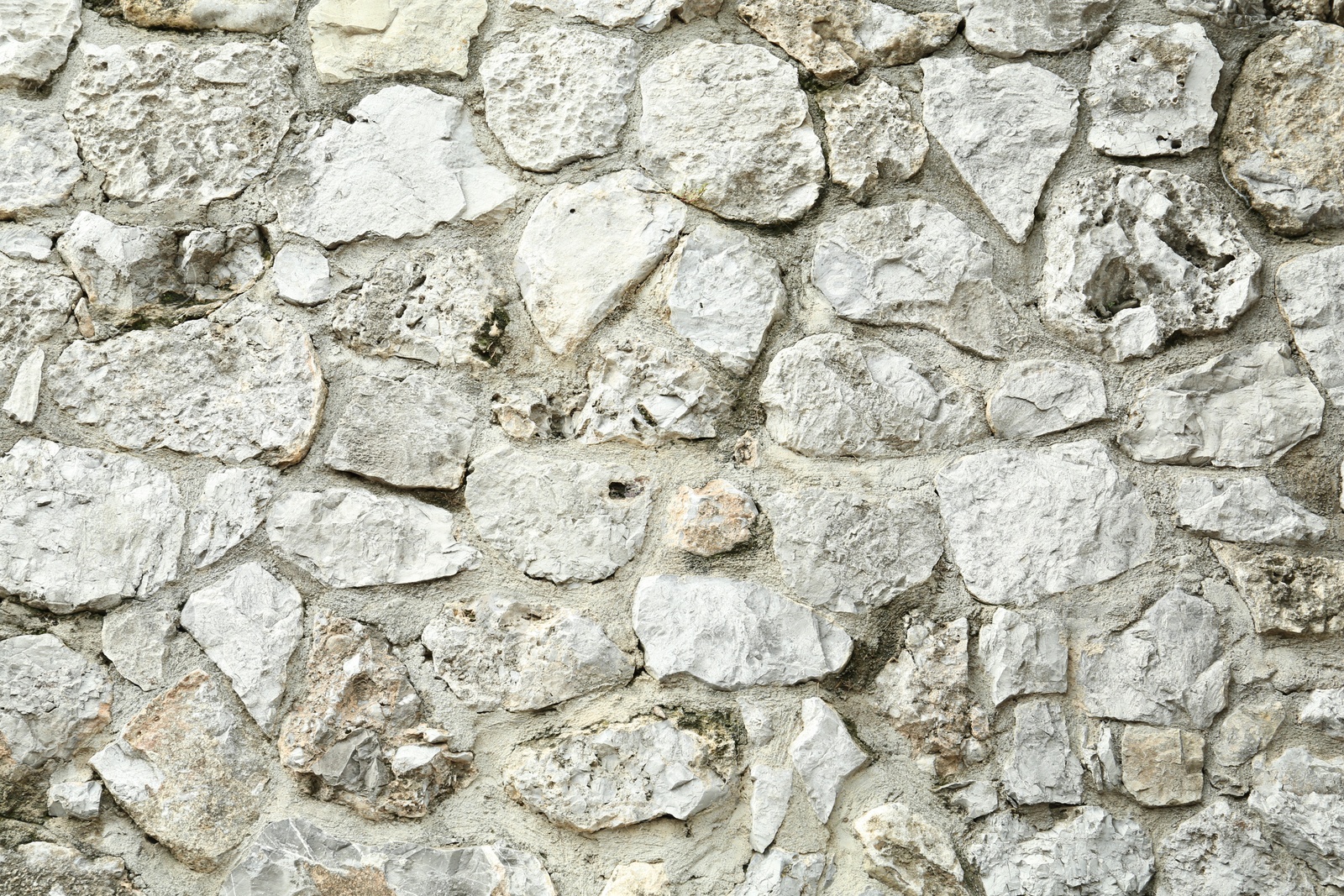 Photo of Texture of stone wall as background, closeup