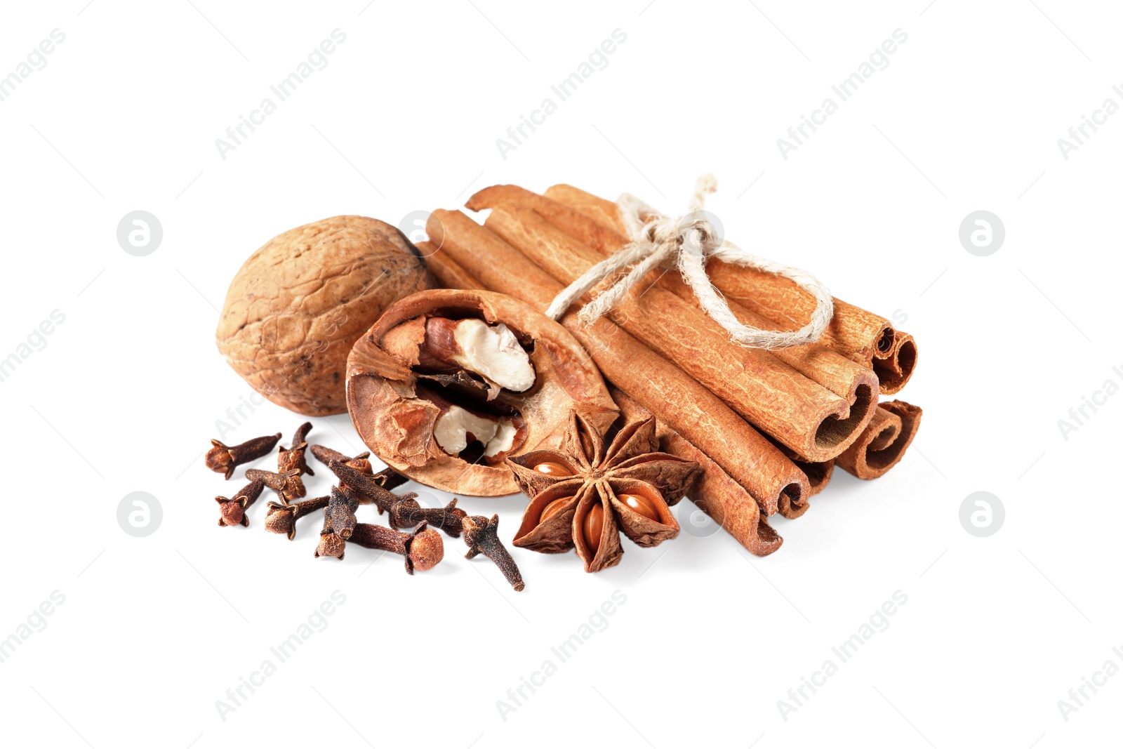 Photo of Different spices and nuts on white background