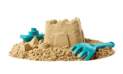 Photo of Beautiful sand castle and plastic beach toys isolated on white. Outdoor play