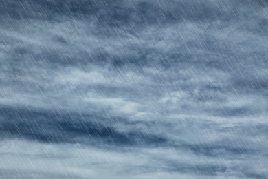 Image of Heavy rain and sky covered with clouds. Stormy weather