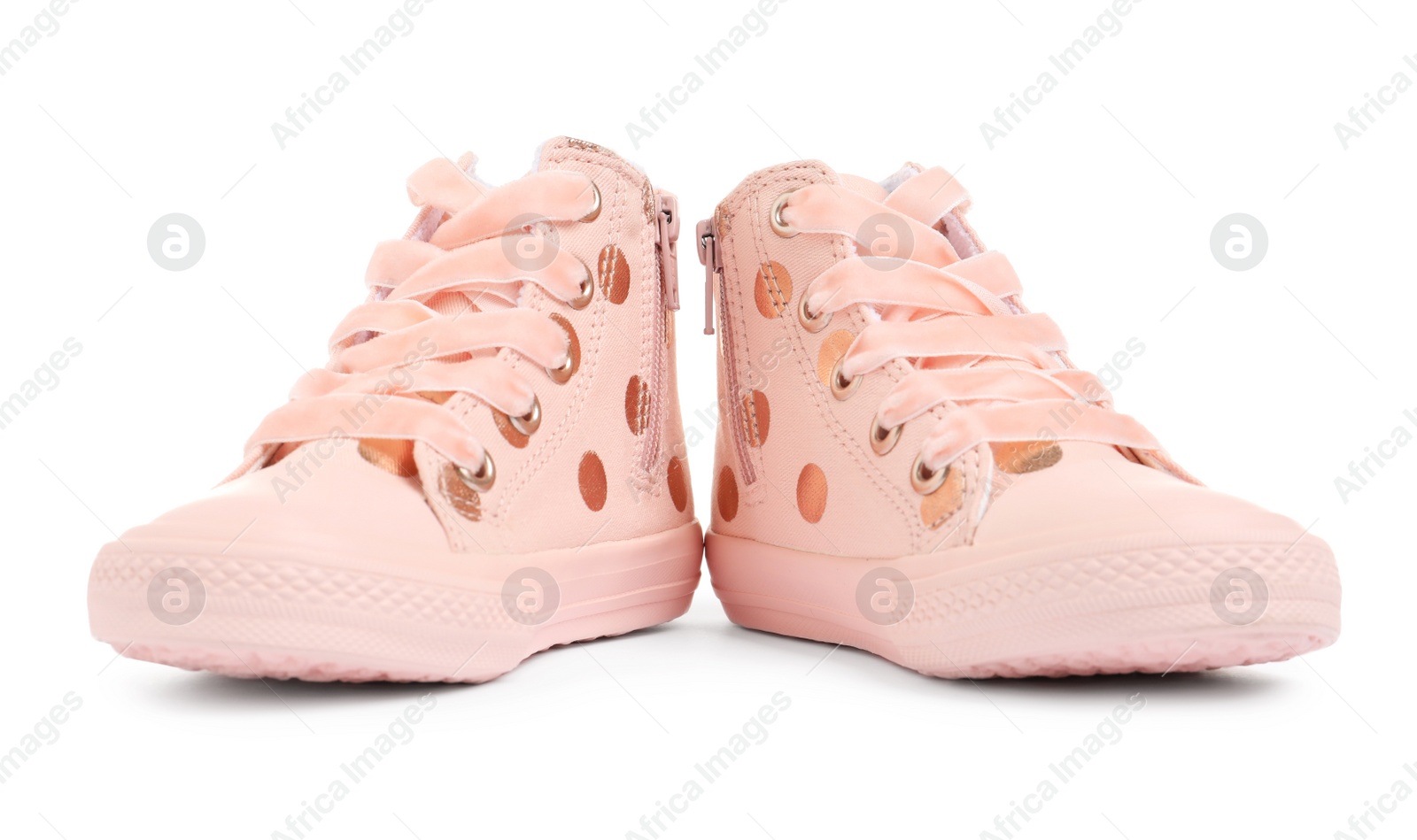 Photo of Pair of stylish child shoes on white background