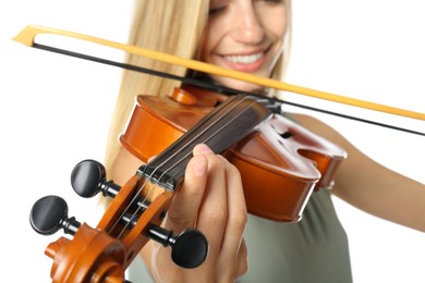 Beautiful woman playing violin on white background, closeup