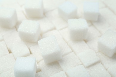 Photo of White sugar cubes as background, closeup view