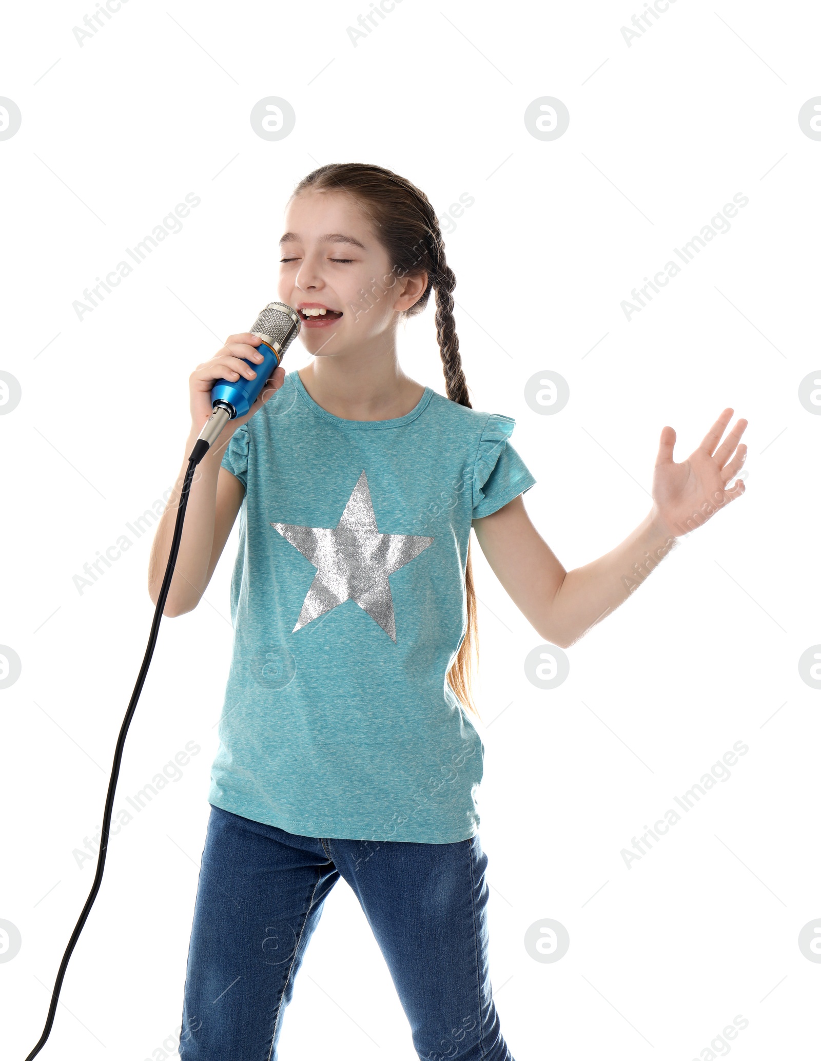 Photo of Cute girl singing in microphone on white background
