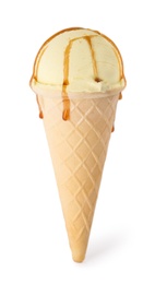 Delicious ice cream with caramel sauce in waffle cone on white background