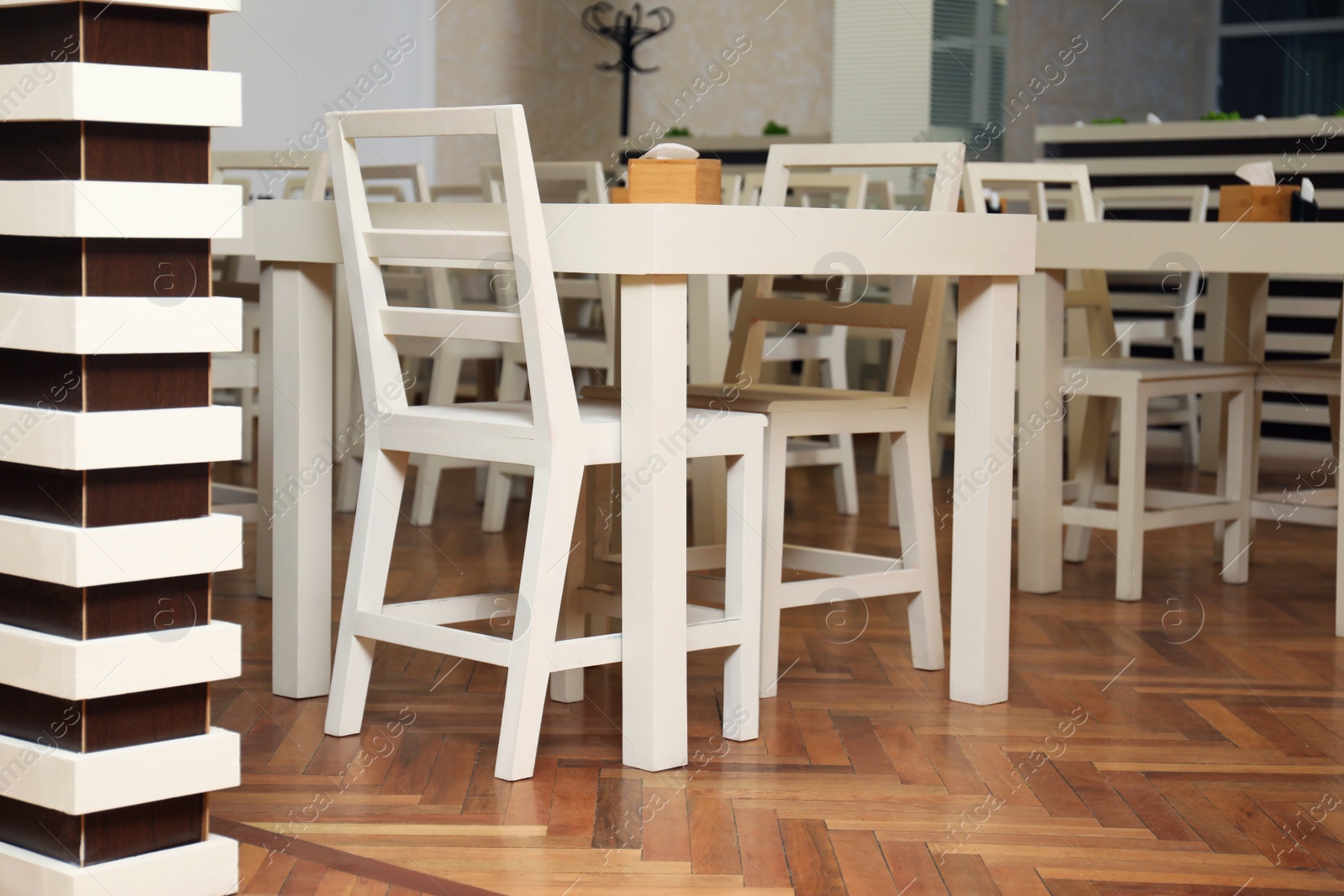 Photo of Stylish interior of school canteen with new furniture