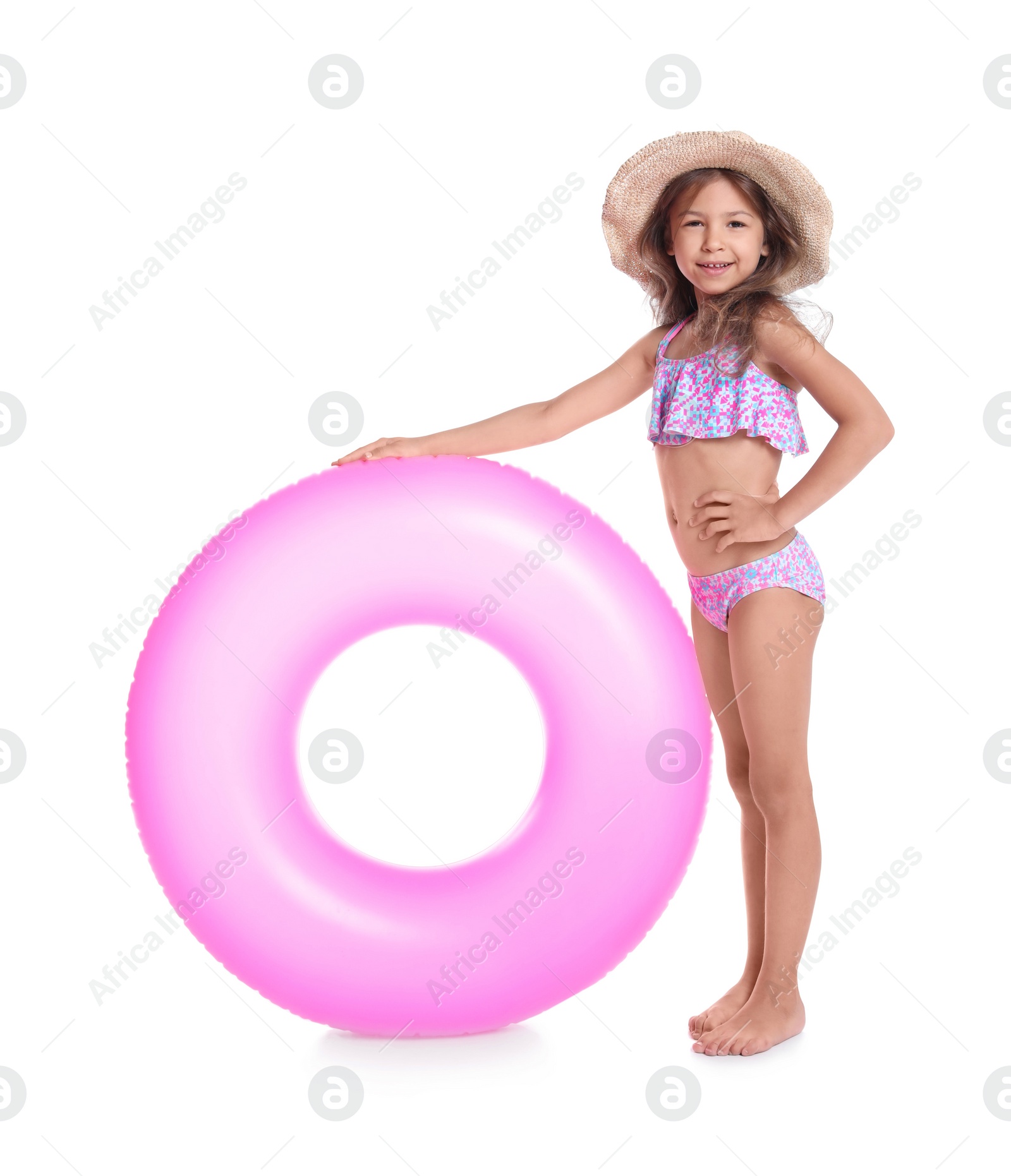 Photo of Cute little girl with inflatable ring on white background