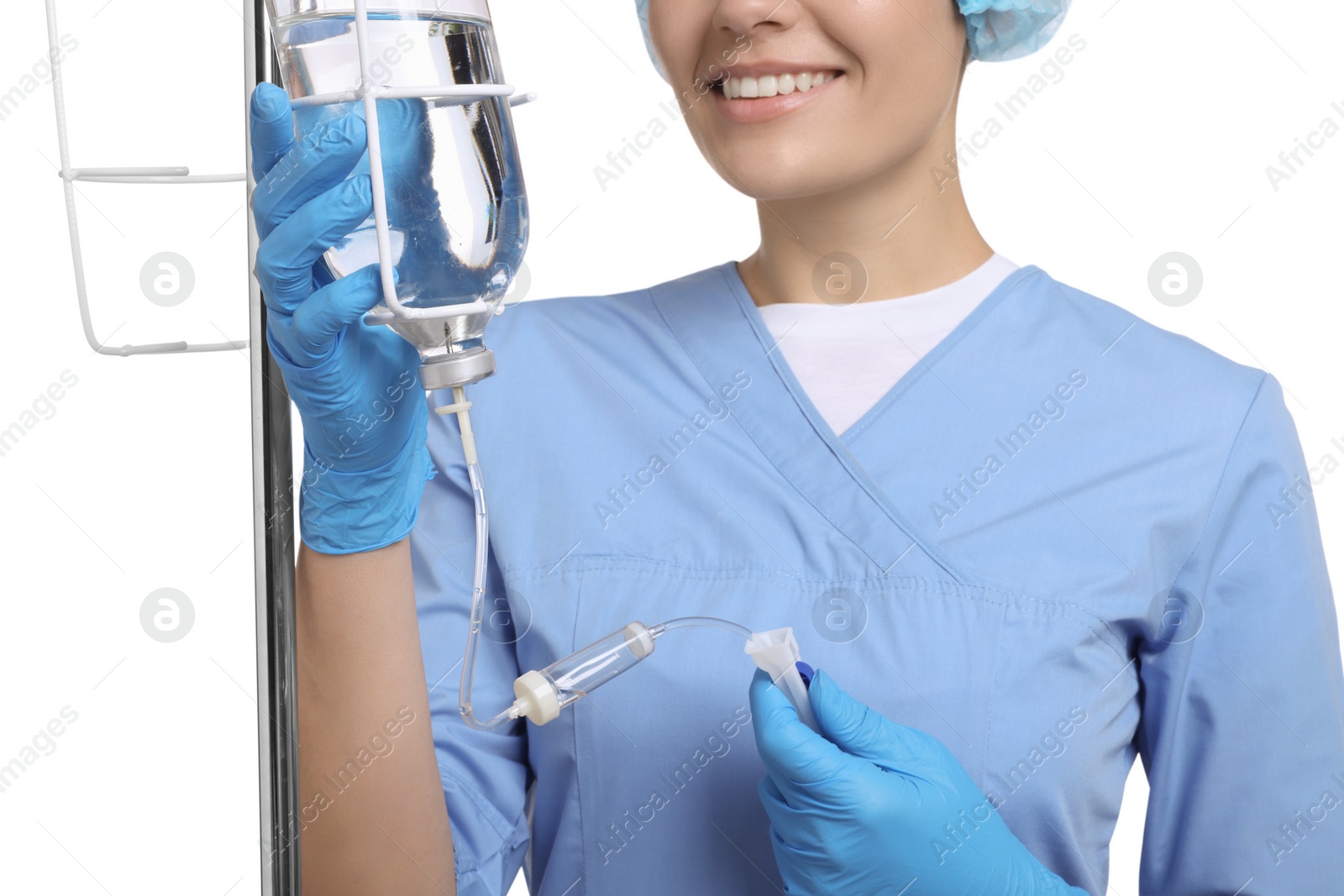 Photo of Nurse setting up IV drip on white background, closeup