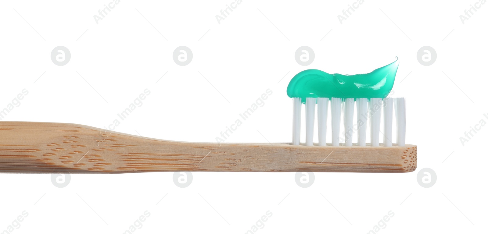 Photo of Wooden toothbrush with paste isolated on white
