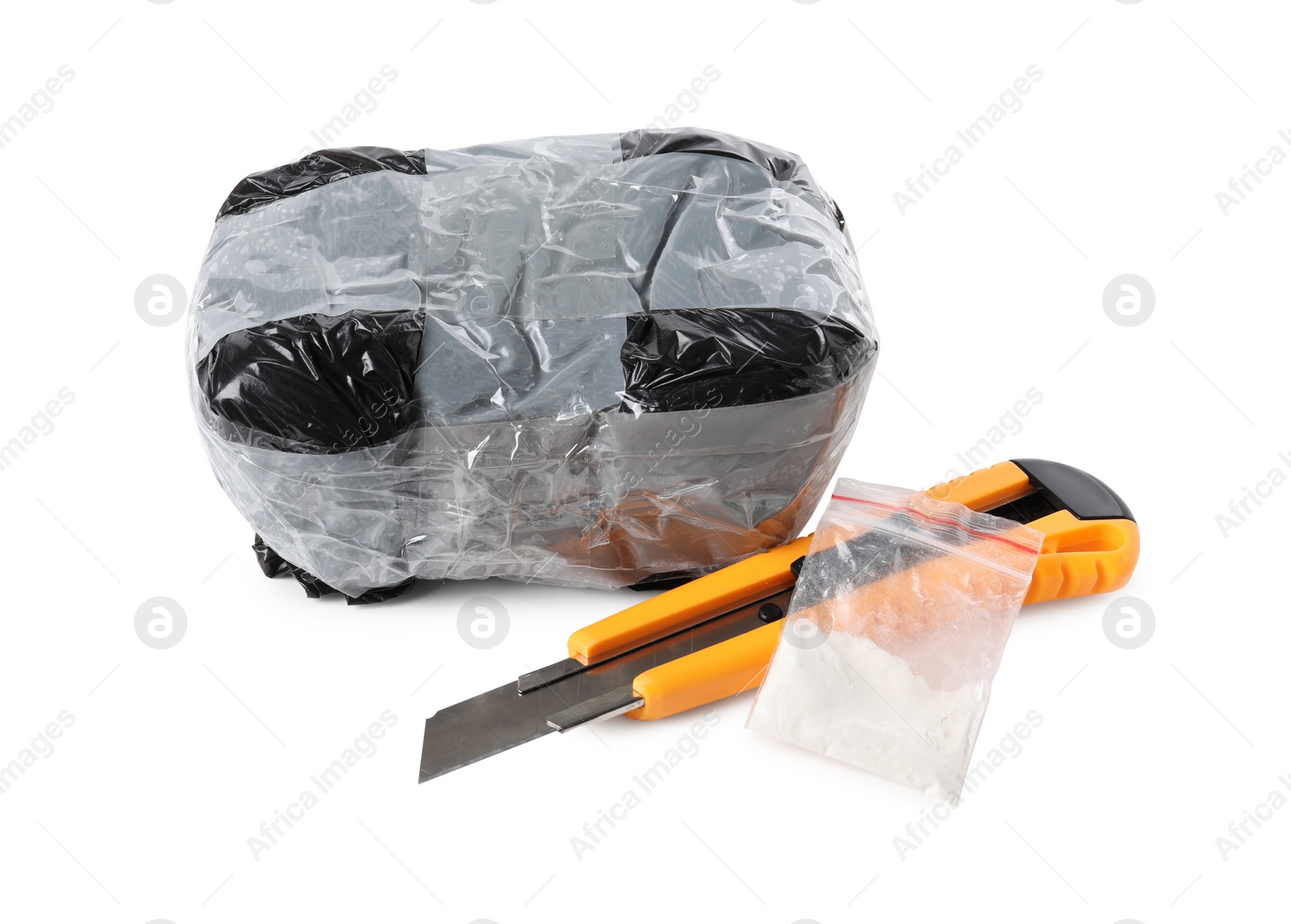 Photo of Packages with narcotics and stationery knife isolated on white