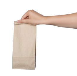 Woman holding paper bag on white background, closeup